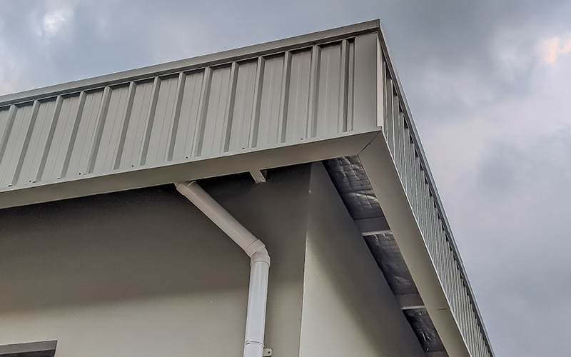 metal roof edge with visible trim and installation details showcasing durability and design for residential building projects including five key elements of roofing systems