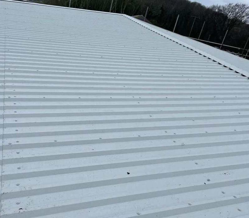 a series of overlapping sheets with a patterned grid featuring five shapes in a green and grey color scheme